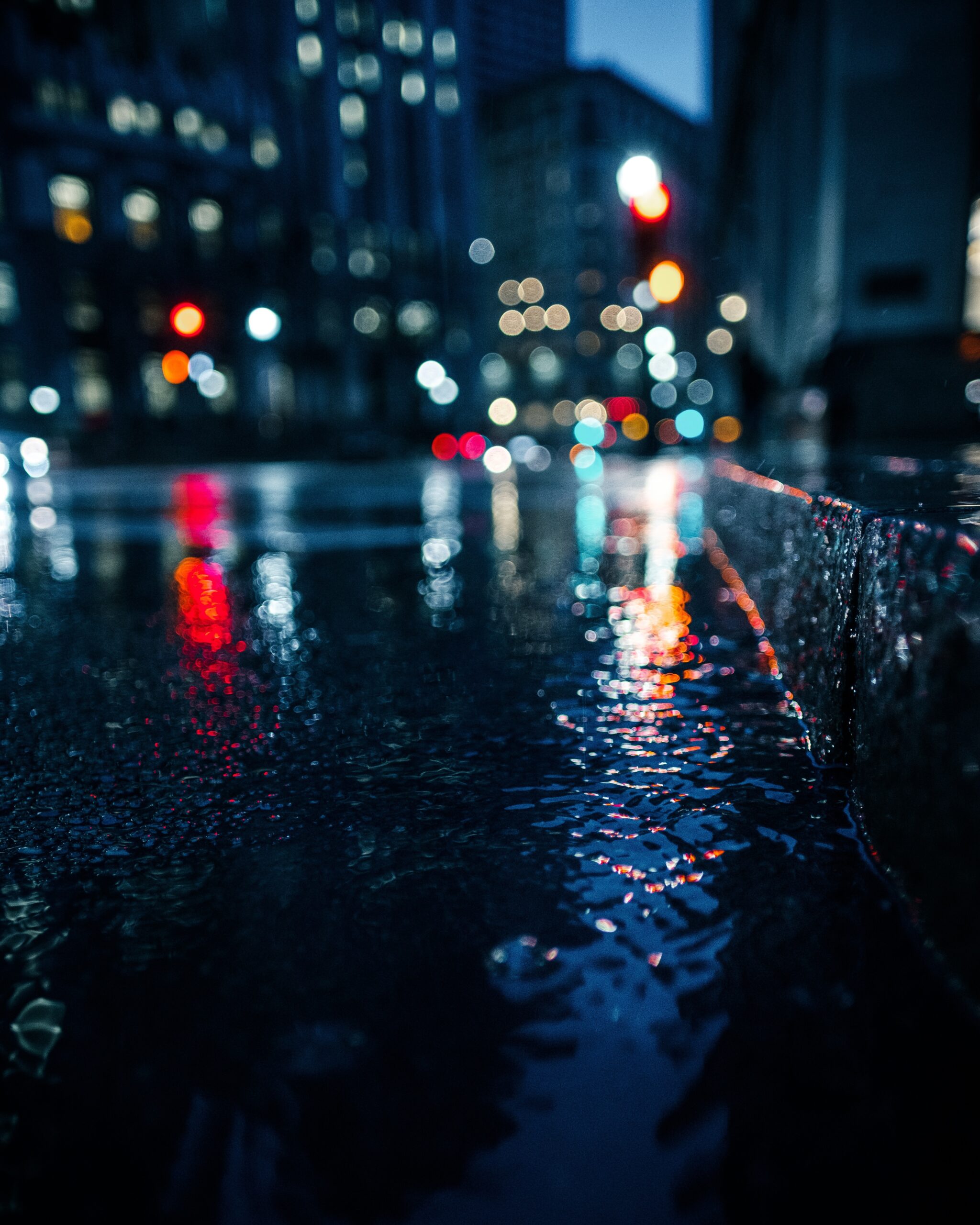 Omaha streetlights reflected on wet asphalt pavement