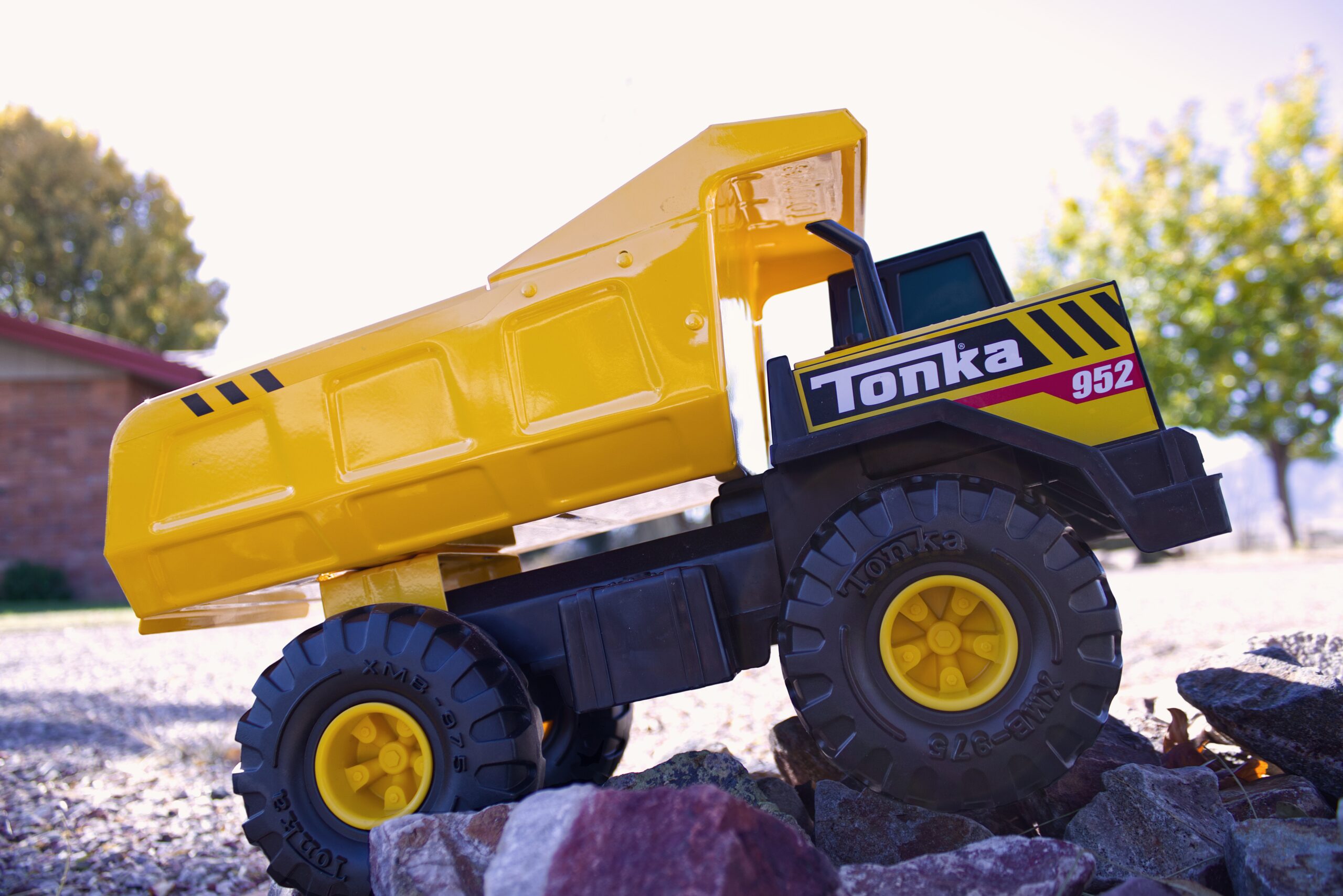 Toy truck on a smooth surface, symbolizing efficient material hauling and logistics in construction projects.