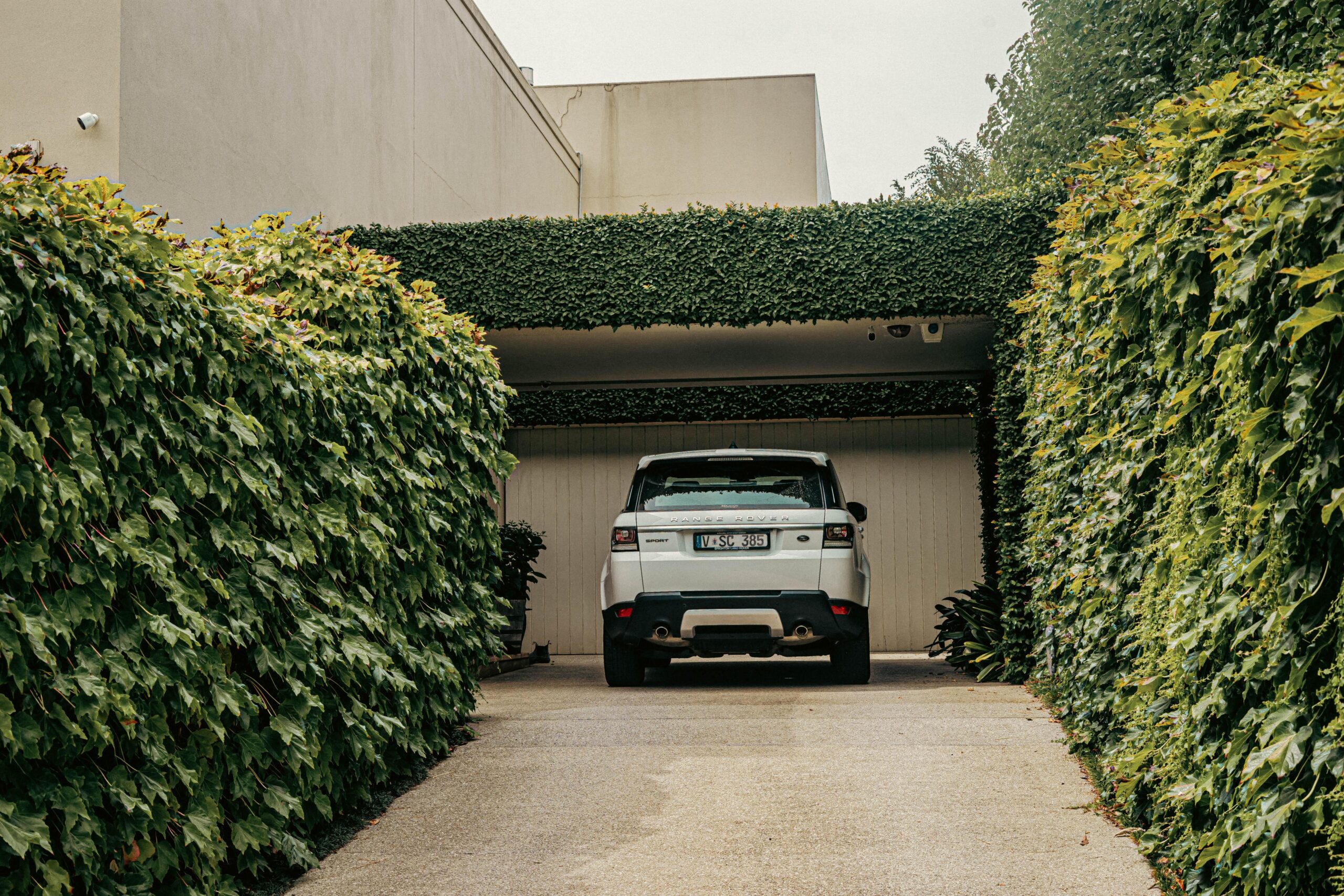 Residential asphalt driveway in front of a suburban home during summer in Omaha, Nebraska